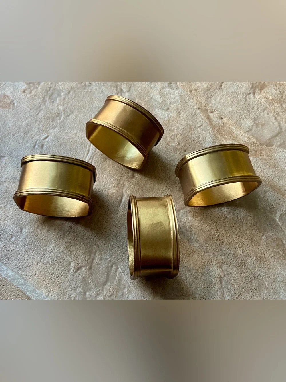 Set a four brass napkin rings